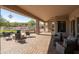 Spacious covered patio features an outdoor kitchen, fire pit, and ample seating for entertaining at 35108 N 139Th Way, Scottsdale, AZ 85262