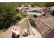 View from a spiral staircase overlooking the pool and landscaped backyard at 35108 N 139Th Way, Scottsdale, AZ 85262