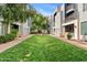 Manicured green lawn, with a walkway, surrounded by modern residential buildings, enhancing the community's appeal at 3633 N 3Rd Ave # 1035, Phoenix, AZ 85013