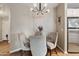 Cozy dining area with stylish lighting fixture, table, and modern chairs at 3633 N 3Rd Ave # 1035, Phoenix, AZ 85013
