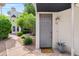 Inviting front entryway of home with gray door and desert landscaping at 3633 N 3Rd Ave # 1035, Phoenix, AZ 85013