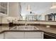 Bright kitchen with stainless steel sink, modern faucet, and granite countertops at 3633 N 3Rd Ave # 1035, Phoenix, AZ 85013