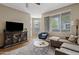 Cozy living room with a plush sectional sofa, stylish furnishings, and lots of natural light at 3633 N 3Rd Ave # 1035, Phoenix, AZ 85013