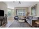 Comfortable living room with hardwood floors, natural lighting, and plush seating at 3633 N 3Rd Ave # 1035, Phoenix, AZ 85013
