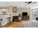 Open-concept living room with hardwood floors, fireplace, and adjacent kitchen at 3633 N 3Rd Ave # 1035, Phoenix, AZ 85013