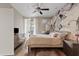Serene main bedroom with designer wallpaper, soft lighting, and a large window at 3633 N 3Rd Ave # 1035, Phoenix, AZ 85013