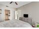 Inviting main bedroom with plush bedding, modern dresser, and view to ensuite bathroom at 3633 N 3Rd Ave # 1035, Phoenix, AZ 85013
