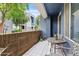 Relaxing outdoor patio with tiled floor, brick wall, and patio furniture, perfect for enjoying the fresh air at 3633 N 3Rd Ave # 1035, Phoenix, AZ 85013
