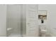 This bright bathroom features a glass shower, white marble walls, and a modern toilet with neutral-toned accents at 3758 E Gold Mountain Ave, San Tan Valley, AZ 85143