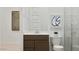 Bathroom features a modern vanity, framed wall art, contemporary fixtures, and seamless glass shower for a spa-like retreat at 3758 E Gold Mountain Ave, San Tan Valley, AZ 85143