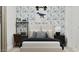 Stylish bedroom showcases vibrant wallpaper, comfortable bed, and natural light for a playful yet serene retreat at 3758 E Gold Mountain Ave, San Tan Valley, AZ 85143