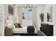 Serene bedroom featuring a stylish bed, modern decor, and ample natural light at 3758 E Gold Mountain Ave, San Tan Valley, AZ 85143