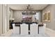 Elegant dining room showcasing a stylish chandelier, a large TV and comfortable seating at 3758 E Gold Mountain Ave, San Tan Valley, AZ 85143