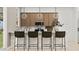 Modern kitchen featuring sleek countertops, an island with seating, and stylish pendant lights at 3758 E Gold Mountain Ave, San Tan Valley, AZ 85143