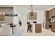 Bright kitchen featuring modern appliances, stylish cabinetry, and an adjacent dining area at 3758 E Gold Mountain Ave, San Tan Valley, AZ 85143
