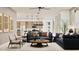 Open-concept living room featuring modern furniture and a seamless flow to the kitchen at 3758 E Gold Mountain Ave, San Tan Valley, AZ 85143