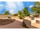 The backyard features a built-in grill and a patio area, perfect for outdoor cooking and entertaining at 4038 E Wrangler Ct, Gilbert, AZ 85297