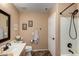 Bathroom featuring a single sink vanity and shower tub combination at 4038 E Wrangler Ct, Gilbert, AZ 85297