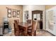 Cozy dining area with a wooden table, adjacent to the kitchen and living spaces at 4038 E Wrangler Ct, Gilbert, AZ 85297