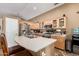 Well-equipped kitchen with stainless steel appliances, modern countertops, and an eat-in breakfast bar at 4038 E Wrangler Ct, Gilbert, AZ 85297