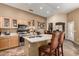 Bright kitchen featuring stainless steel appliances, a breakfast bar, and ample counter space at 4038 E Wrangler Ct, Gilbert, AZ 85297