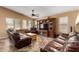 Spacious living room with tile flooring and natural light, featuring a built-in entertainment center at 4038 E Wrangler Ct, Gilbert, AZ 85297