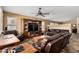 Inviting living room with entertainment center and comfortable leather furniture for relaxation at 4038 E Wrangler Ct, Gilbert, AZ 85297