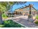 Shaded tennis court area with a pergola, enhancing the recreational amenities for residents at 4038 E Wrangler Ct, Gilbert, AZ 85297