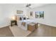 Tranquil bedroom featuring a ceiling fan and bright window, cozy bed, and wicker accents for a comfortable and inviting space at 4201 E Camelback Rd # 70, Phoenix, AZ 85018