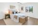 Bright bedroom featuring a cozy bed with decorative pillows and a ceiling fan and shuttered windows providing natural light at 4201 E Camelback Rd # 70, Phoenix, AZ 85018