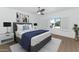 Nicely staged bedroom with king bed, modern fixtures, and shutters overlooking the exterior at 4201 E Camelback Rd # 70, Phoenix, AZ 85018