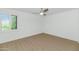 Empty room with shutters, hardwood flooring and a ceiling fan with light fixture at 4201 E Camelback Rd # 70, Phoenix, AZ 85018