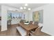 Dining area with modern chandelier, bright light, and wood table perfect for gatherings at 4201 E Camelback Rd # 70, Phoenix, AZ 85018