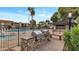 Community grill with stone surround and pool views perfect for outdoor gatherings at 4201 E Camelback Rd # 70, Phoenix, AZ 85018