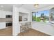 Bright breakfast nook with kitchen view and bar stool seating with natural light at 4201 E Camelback Rd # 70, Phoenix, AZ 85018