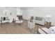 Bright living room with modern decor and light wood floors showcasing an open floor plan at 4201 E Camelback Rd # 70, Phoenix, AZ 85018