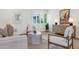 Bright and stylish living room highlighting contemporary decor, tasteful artwork, and seamless flow through shuttered windows at 4201 E Camelback Rd # 70, Phoenix, AZ 85018