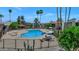 Community pool surrounded by lush landscaping and lounge chairs perfect for relaxation at 4201 E Camelback Rd # 70, Phoenix, AZ 85018