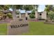 Villa Green complex signage featuring address and community name surrounded by a lush lawn at 4201 E Camelback Rd # 70, Phoenix, AZ 85018