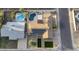 Aerial view showcasing the pool, desert landscaping, solar panels, and privacy fence at 4202 W Purdue Ave, Phoenix, AZ 85051