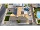 Overhead view featuring the pool, patio area, landscaping, solar panels, and fencing at 4202 W Purdue Ave, Phoenix, AZ 85051
