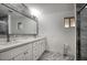 Bathroom features dual sinks, a large mirror and luxurious walk-in shower at 4202 W Purdue Ave, Phoenix, AZ 85051