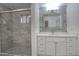 Bathroom features a large vanity, glass shower doors and updated fixtures at 4202 W Purdue Ave, Phoenix, AZ 85051