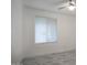 Bedroom features white walls, marble floors, modern ceiling fan and window with blinds at 4202 W Purdue Ave, Phoenix, AZ 85051