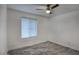 Bedroom features white walls, marble floors, modern ceiling fan and window with blinds at 4202 W Purdue Ave, Phoenix, AZ 85051