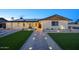 Beautiful house featuring an illuminated walkway, new landscaping, and well-kept front lawn at 4202 W Purdue Ave, Phoenix, AZ 85051
