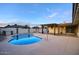Lush backyard featuring a refreshing swimming pool, covered patio, and a charming outdoor seating area at 4202 W Purdue Ave, Phoenix, AZ 85051
