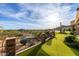 A pristine putting green and desert landscape blend seamlessly in this peaceful backyard at 4328 N Pinnacle Ridge Cir, Mesa, AZ 85207