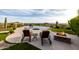 Stunning outdoor oasis with pool, spa, fire pit, seating, and beautiful landscape at 4328 N Pinnacle Ridge Cir, Mesa, AZ 85207