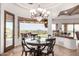 Bright breakfast nook features a modern chandelier and a large bay window with gorgeous views at 4328 N Pinnacle Ridge Cir, Mesa, AZ 85207